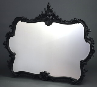 A Victorian style shaped plate mirror contained in a decorative resin frame 105cm x 134cm 