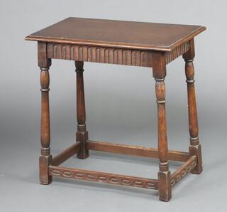 A rectangular oak side table with arcaded decoration to the frieze, raised on turned and block supports with box framed stretcher 67cm h x 67cm w x 40cm d 