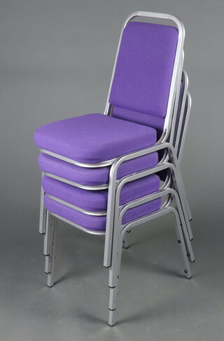 Four tubular metal stacking office chairs, the seats and backs upholstered in purple material 85cm h x 39cm w x 41cm d 