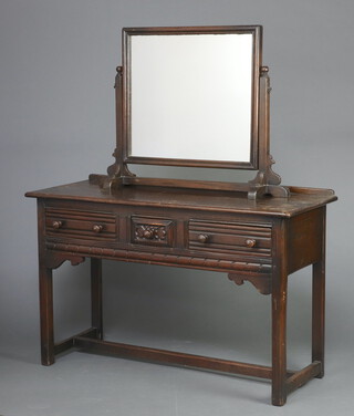 An Ercol style carved oak dressing table with separate rectangular plate mirror, the base fitted 1 short and 2 long drawers, raised on turned supports 146cm h x 121cm w x 49cm d (water and contact marks in places) 