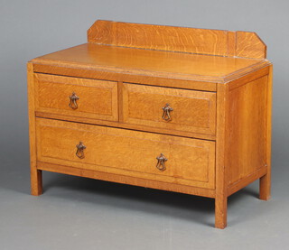 A 1930's light oak chest of 2 short and 1 long drawers 69cm h x 88cm w x 43cm d 