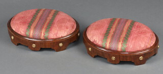 A pair of Regency oval walnut and gilt studded footstools with drop in seats 10cm x 38cm x 27cm 