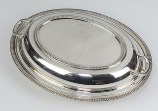 An oval silver entree dish and cover Sheffield 1936, 28cm 903 grams 
