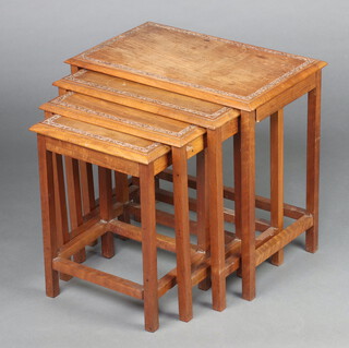 A nest of 4 1920's carved Burmese hardwood coffee tables on square supports 47cm h x 51cm w x 31cm d, smallest 41cm h x 31cm w x 25cm d 