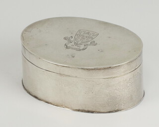 An oval white metal 19th Century engraved tobacco box with a crest 8.5cm, 105 grams 
