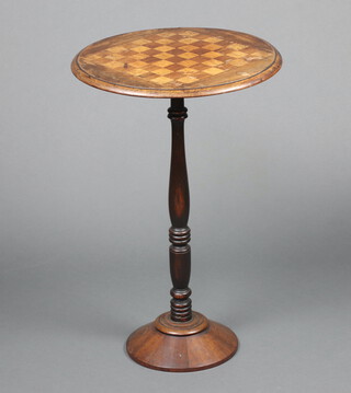 A 19th Century circular inlaid mahogany chess table, raised on a turned column and circular spreading foot 71cm h x 47cm diam. 