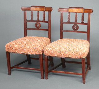 A pair of 19th Century mahogany inlaid stick and rail back dining chairs with overstuffed seats raised on square tapered supports, H framed stretchers 80cm h x 50cm w x 43cm d (seat 25cm x 27cm) 