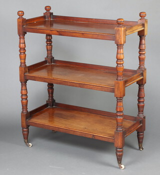 A Victorian rectangular mahogany 3 tier buffet on turned and block supports with ceramic casters 116cm h x 94cm w x 45cm d 