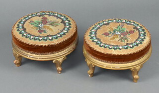 A pair of Victorian circular gilt painted footstools with beadwork upholstery, raised on cabriole supports 16cm x 28cm 