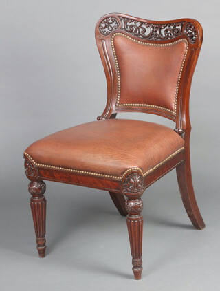 A Victorian carved and pierced mahogany standard chair, the back and seat upholstered in brown material, raised on turned and reeded supports 87cm h x 50cm w x 50cm d (seat 22cm x 27cm) 