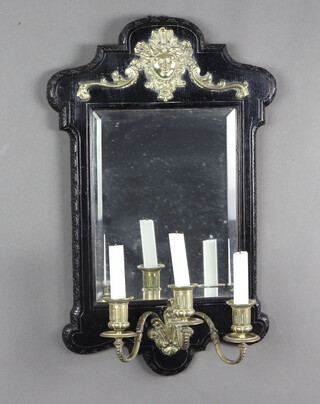 A 19th Century rectangular plate mirror contained in an ebonised and gilt mounted frame, the base fitted 3 candle sconces 57cm x 38cm 