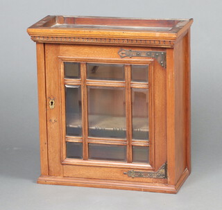 An Edwardian walnut hanging cabinet with moulded cornice, fitted a shelf enclosed by a bevelled glazed door 53cm h x 49cm w x 24cm d 