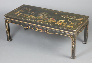 A rectangular black lacquered chinoiserie coffee table raised on square supports 44cm x 110cm x 50cm 