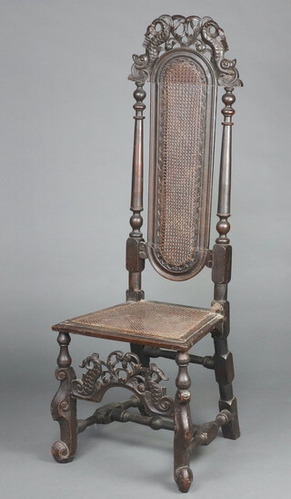 A 17th/18th Century  carved walnut high back chair, the pierced and cast cresting rail decorated dolphins and woven cane back and seat, raised on dolphin supports with carved apron to the front decorated dolphins 133cm h x 45cm w x 37cm d 
