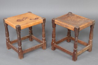 Robert "Mouseman" Thompson of Kilburn, a pair of oak stools, raised on octagonal turned and block supports with brown leather seats, both with carved mouse to one leg  46cm h x 42cm w x 37cm d