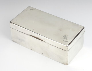 An Art Deco rectangular silver cigarette box Birmingham 1937, 17cm, with engraved inscription 