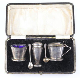 An Art Deco silver 3 piece condiment set of tapered form Birmingham 1934, 99 grams 
