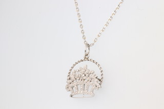 An Edwardian white metal chain 46cm with a white metal diamond set pendant in the form of a basket of flowers 20mm, 7.8 grams 