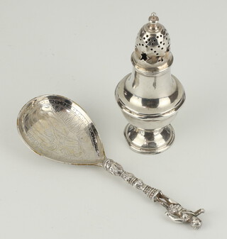 A silver pepperette with weighted base together with a Continental silver spoon with figural terminal, gross weight 66 grams 