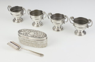 A set of 4 silver miniature 2 handled trophy cups, Chester 1899, a sugar shovel and a silver lidded jar, 127 grams