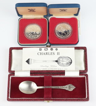 Two 1977 commemorative silver medallions together with a silver scroll back spoon Sheffield 1976, 84 grams