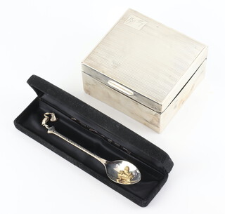 A silver cigarette box London 1928 10cm and a silver commemorative spoon 