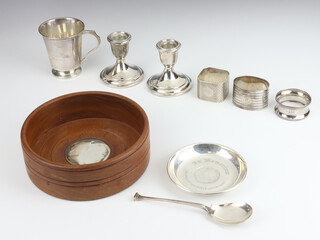 A silver Art Deco cup Chester 1939, 3 napkin rings, a spoon, pin dish, dwarf candlesticks and a coaster, weighable silver 206 grams