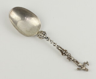 A 19th Century Continental silver dessert spoon with figural terminal 57 grams, 19cm 