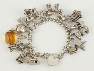 A silver charm bracelet, gross weight 77 grams