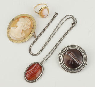 A yellow metal 750 cameo ring size M 1/2, 2 brooches and a pendant and chain 