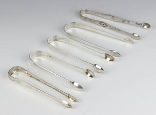 A pair of George III sugar tongs London 1810 by Peter and William Bateman and 4 other pairs
