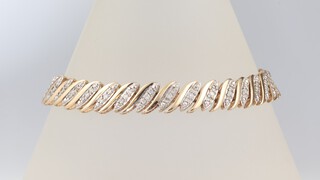 A 9ct yellow gold diamond set bracelet 18cm, 15.5 grams 