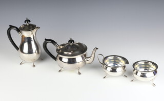 A stylish silver plated ebony mounted tea and coffee set on pad feet 