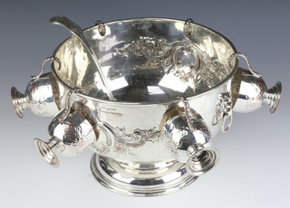 A Georgian style repousse silver plated pedestal punch bowl with 6 cups and ladle 
