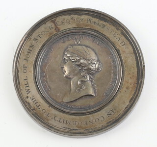 A white metal commemorative medallion 