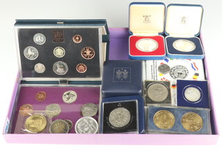 Two commemorative silver medallions, each 28 grams and minor commemorative coins and crowns 