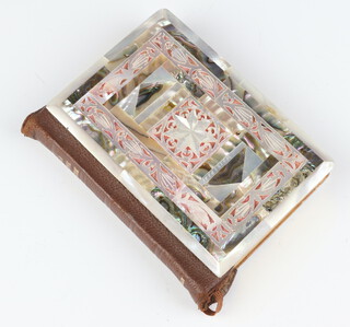 A mother of pearl mounted book of The New Testament 