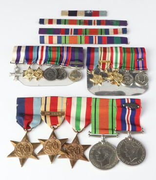 A Second World War medal group 1939-45 Star, Africa Star with 8th Army bar, Italy Star, Defence War medal with cluster together with a miniature dress set of medals Military Cross, 1939-45 Star, France and Germany Star, Defence War medal and General Service medal with Palestine 1945-48 bar 