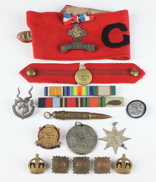 A Somaliland Camel Corps cap badge, 2 General Staff red epaulettes, medal ribbons etc 