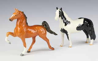 A Beswick figure of a prancing light bay horse 16cm and 1 other Pinto Pony No 1373 piebald gloss standing by Arthur Gredington 16cm