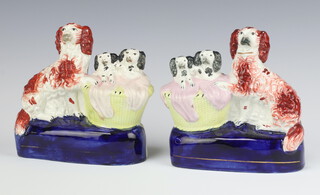 A pair of 19th Century Staffordshire flat back figures of Spaniel with 2 puppies in a basket 14cm 