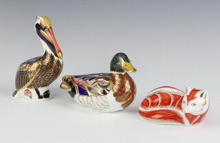 Three Royal Crown Derby Imari pattern paperweights - seated fox the base with gold stopper marked LVIII 9cm, duck with silver stopper marked LX1 9cm and a brown pelican with silver stopper 13cm (second) 