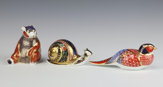 Three Royal Crown Derby Imari pattern paperweights - limited edition garden snail no.699/4005 base signed Sue Rowe, gold stopper 6cm, pheasant with gold stopper LVI 4cm and a bear with gold stopper LVIII  8cm