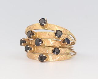 A yellow metal 5 section sapphire set ring, size J, 3 grams 
