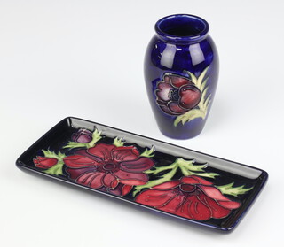 A rectangular Moorcroft pin tray decorated anemones, base impressed Moorcroft 34/94 20cm together with Moorcroft blue glazed anemone pattern vase 10cm 