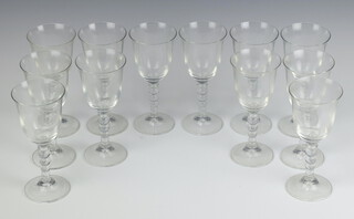 A set of 12 Italian moulded glass wine glasses with bobble stems 