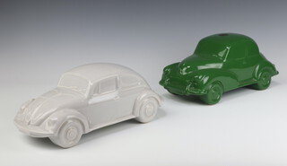 A Dartmouth Pottery green glazed model of a Morris Minor motorcar 33cm with paper label, together with a ditto VW Beetle (unlabelled)  