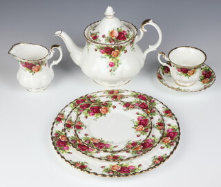 A 68 piece Royal Albert Old Country Rose Pattern dinner/tea service comprising twin handled tureen and cover (second), oval meat plate (second), 8 dinner plates, 8 side plates, 8 tea plates, 2 large circular bowls, a 2 tier cake stand (second), 8 pudding bowls (2 are seconds),2  twin handled plates (1 a second), candlestick (second), 2 circular bowls, oval twin handled dish (second),  oval bowl (second), teapot (second), sugar bowl, salt and pepper, cream jug, 8 tea cups (2 seconds), 9 saucers, 2 similar bowls (both seconds)  