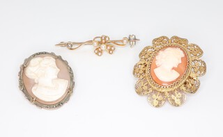 An Edwardian 15ct yellow gold seed pearl bar brooch 2.6 grams, a gilt metal cameo and a silver mounted cameo brooch 