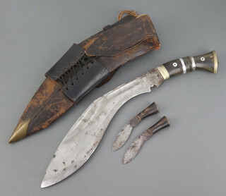 A Kukri, the blade marked Military Supply Syndicate complete with 2 skinning knives, leather scabbard and frog